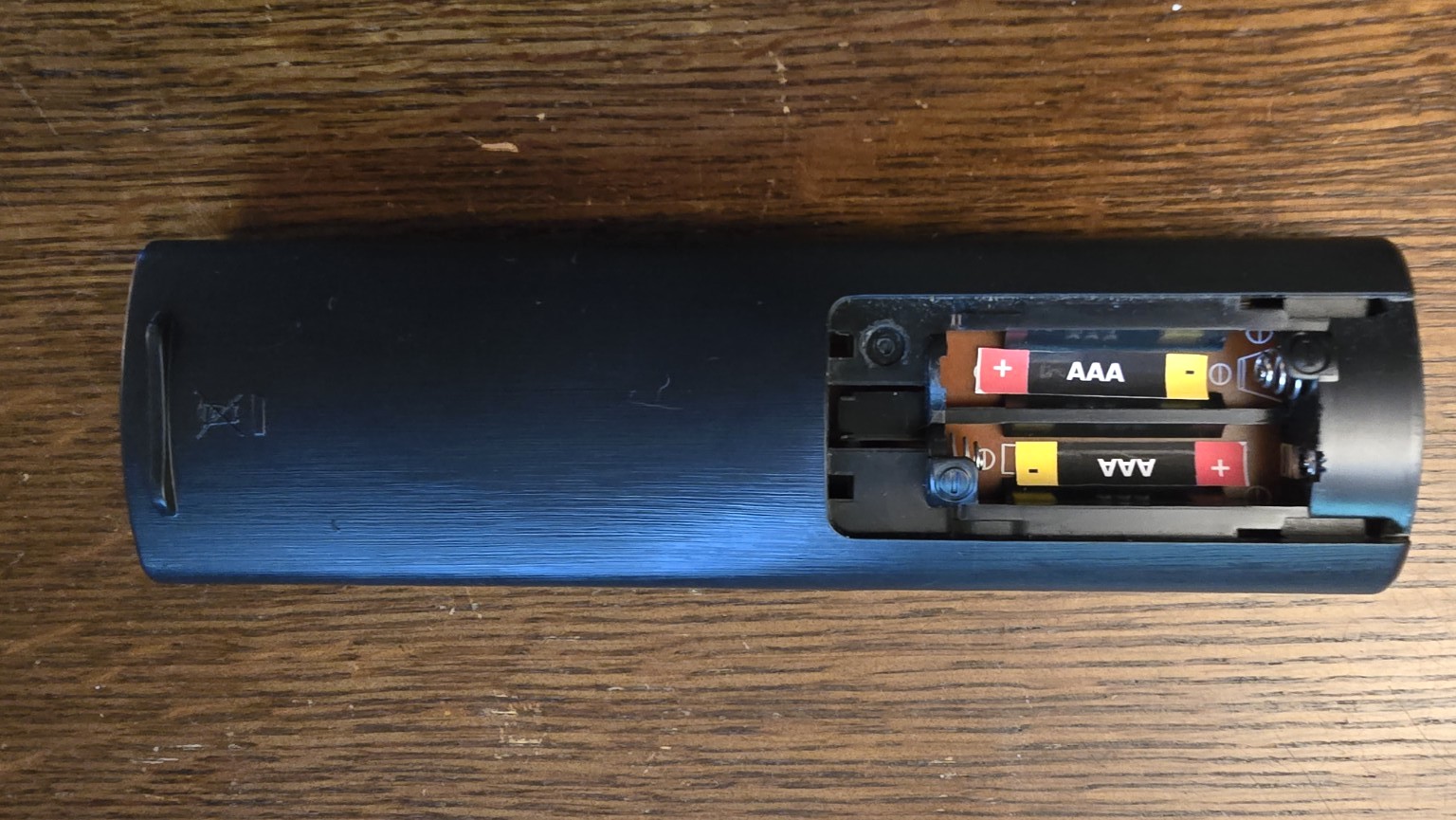 AAA remote control battery compartment using BatteryBright labels